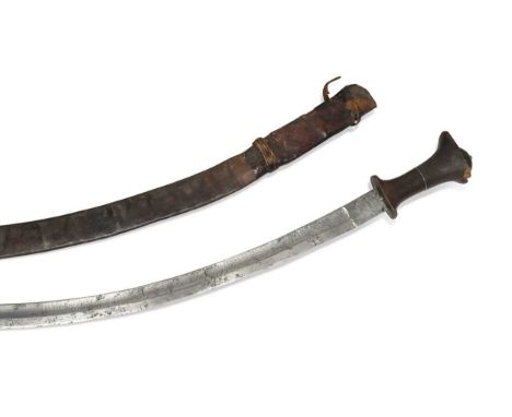 An Ethiopian Gurade sword with rhino horn handle, 19th century,  the curved 81cm (measured against the curve) blade etched wi