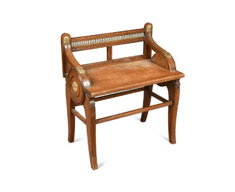 An oak and brass mounted stool in the manner of Jas. Shoolbred, circa 1900, the pierced balustraded top rail with downswept a