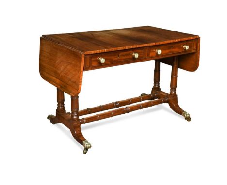 A Regency style rosewood sofa table, the rounded rectangular drop flap top over two real drawers and two opposing dummy drawe