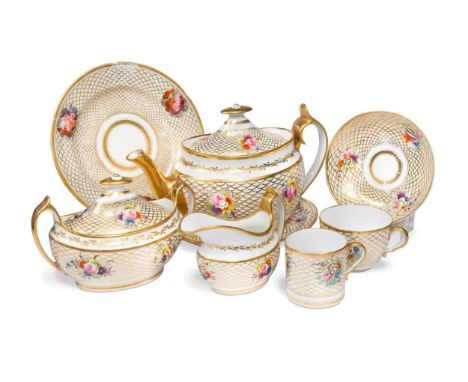 A Spode tea and coffee service, pattern 882, circa 1825, decorated with sprays of flowers on a gilded fish scale ground, comp