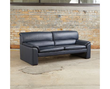 One modern two-cushion sofa, ca. 1990s. Leather and wood.Provenance: Distinguished Corporate Collection, Minnesota.Height: 29