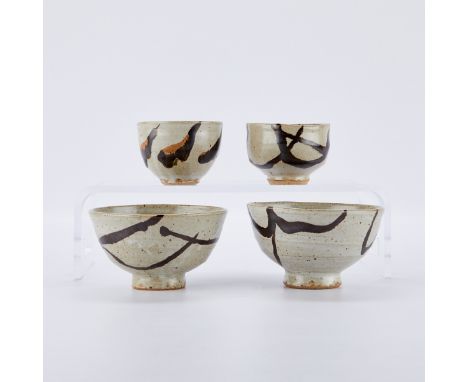 Warren MacKenzie (American, 1924-2018). Set of four studio pottery ceramic tea bowls and bowls. Glazed stoneware with splashe