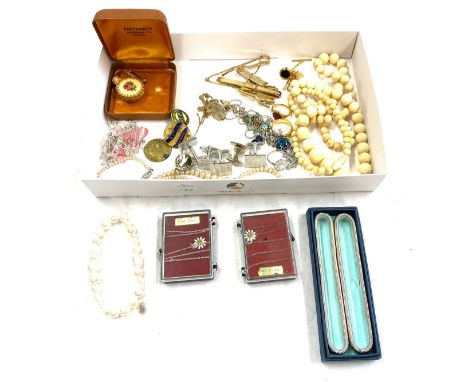 Selection of vintage and later costume jewellery includes badges, beads etc 