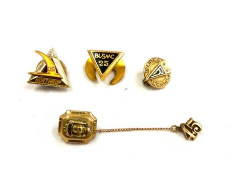 Selection of 4 vintage gold badges includes BLSMC, The Auther ford school, Northrop and Singac