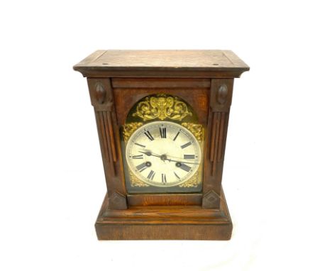 Oak cased 2 key hole mantle clock with key measures approx 13" tall 10.5" wide 6" depth