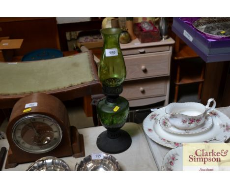 A green glass oil lamp