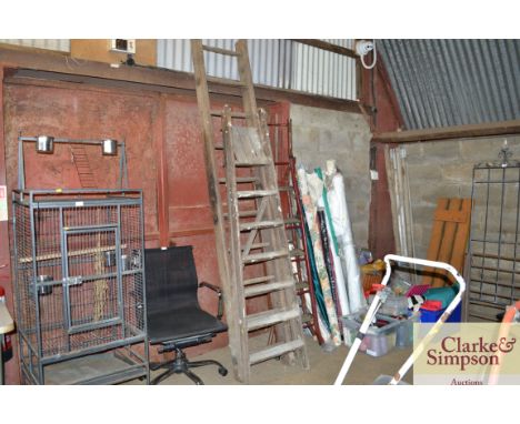 A wooden step ladder together with one other wooden ladder