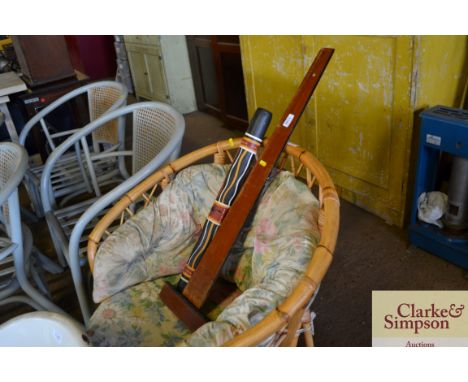 A small didgeridoo together with a T square