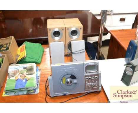 A Ferguson CD stereo and alarm clock with two pairs of speakers
