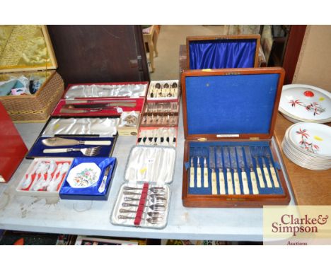 A quantity of boxed cutlery to include a canteen of dessert knives and forks, cake fork a Harrods horn and silver coloured ca