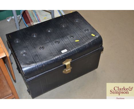 A black painted metal storage trunk  