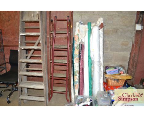 A metal ladder together with a wooden and metal step ladder