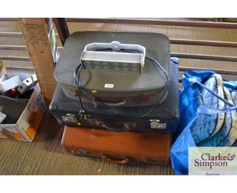 Three suitcases and a LED light
