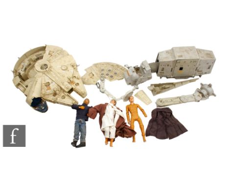 Two vintage Kenner Star Wars toys, a Millennium Falcon and an AT-AT, together with a later Hasbro 12 inch Obi-wan Kenobi acti