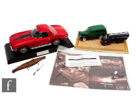 Two Franklin Mint diecast models, to include a 1:24 scale 1946 Chevrolet Suburban with display case and a 1967 Corvette Sting