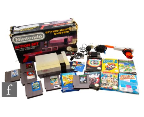 A boxed Nintendo Entertainment System (NES) Action Set, together with a collection of games, some unboxed, to include Teenage