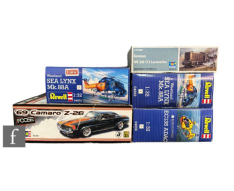 Four Revell plastic model kits to include a 1:12 scale 69 Camaro Z-28, three 1:32 scale models EC135 ADAC, and two Westland S