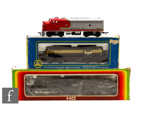 Two boxed HO gauge locomotives, AHM 5131 Monon 23 RS-2 locomotive and Mehanotehnika Izola 4-6-2 Atlantic Coat Line black 1523