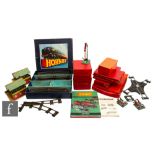 A collection of O gauge Hornby items, boxed and unboxed track and scenic accessories, to include