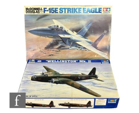 A Tamiya 1:32 scale 60302 F-15 Strike Eagle plastic model kit, together with a Trumpeter 1:48 scale 02823 Wellington Mk. III,