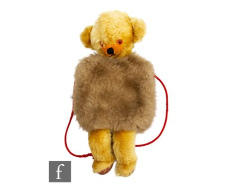 A Merrythought Cheeky Bear vintage muff, golden mohair, with beige plush muff, amber and black plastic eyes, inset velveteen 