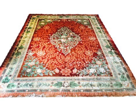 FINE SILK SAVONNERIE DESIGN CANTONESE CARPET, 365cm x 275cm, floral design, on a ruby field, within corresponding borders.