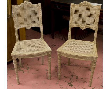 SIDE CHAIRS, a pair, French Louis XVI style painted, each with caned back and seat. (2)