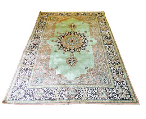 PURE SILK TEHRAN DESIGN CARPET, 275cm x 182cm, pendant medallion on a jade field within corresponding guard stripes and corre