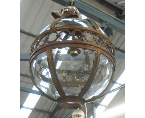 GLOBE LANTERN, in a bronzed frame, 41cm diam. plus chain.