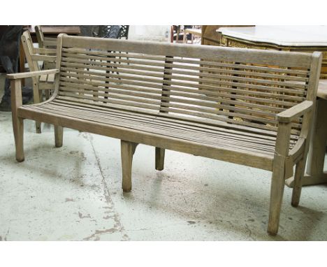 GARDEN BENCH, weathered slatted teak with curved seat, 217cm W.