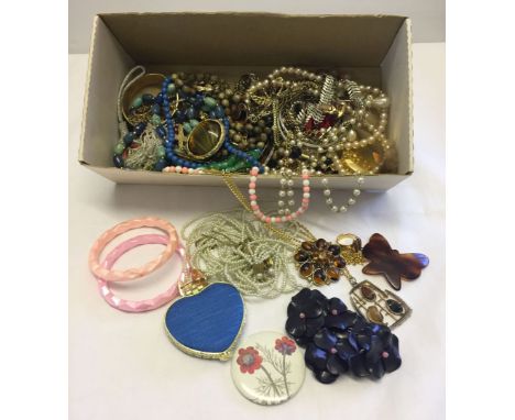 A box of vintage costume jewellery.