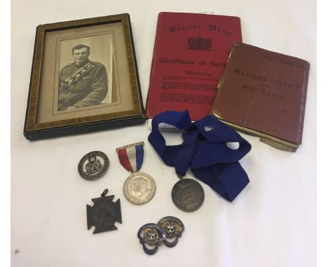 A small quantity of medals and badges to include Services Rendered badge and silver medal from the E. Anglian Catering Exhibi