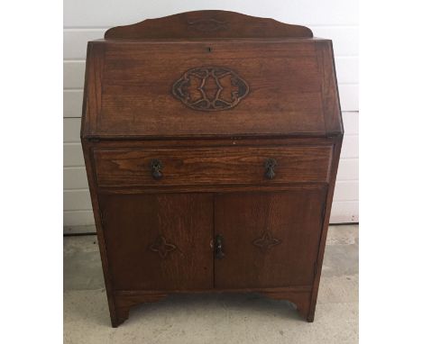 A vintage dark oak bureau. Approx 75 x 106cm.