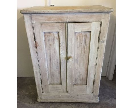 A vintage pine 2 door cupboard with 2 shelves inside. 75cm wide x 104cm high.