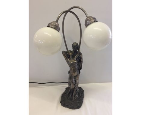 A modern 2 light lamp with entwined lovers design.
