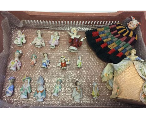 A collection of 17 ceramic half dolls to include bottle stopper head tea cosy.