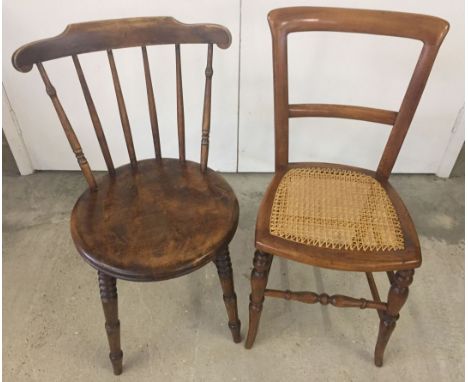 A vintage cane seated bedroom chair together with a dark oak spindle backed kitchen chair.