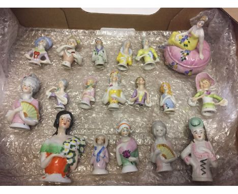 A collection of 18 ceramic half dolls to include a lidded trinket box.