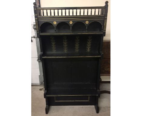 An Arts and Crafts ebonised and gilded dresser top/shelf. Approx 76.5 x 146.5cm.