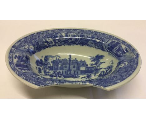 A blue & white ceramic Victoria Ware Ironstone shaving bowl. With shaped front.