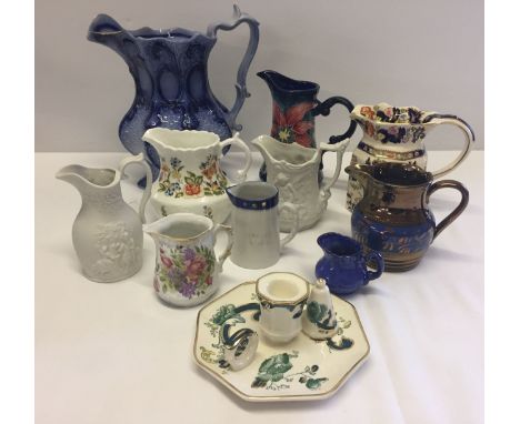A box of mixed ceramics, mostly jugs to include a Masons 'Mandarin' jug and a Masons 'Chartreuse' candlestick and snuffer.