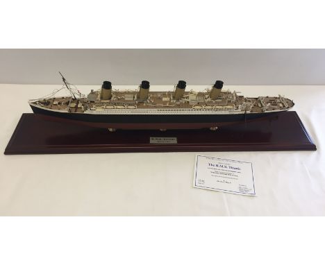 A 1:400 scale model of R.M.S Titanic with CoA.