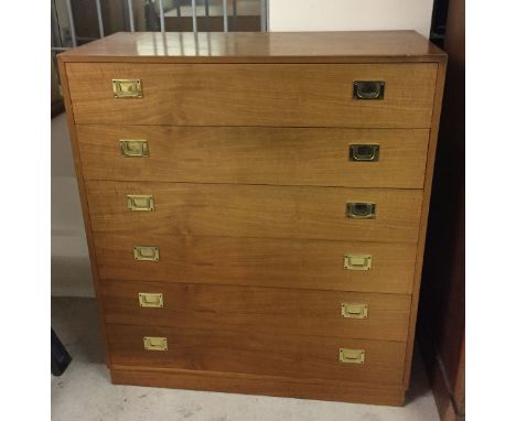 A light oak 6 drawer chest of drawers with flush brass handles. 88cm wide x 100.5cm tall.