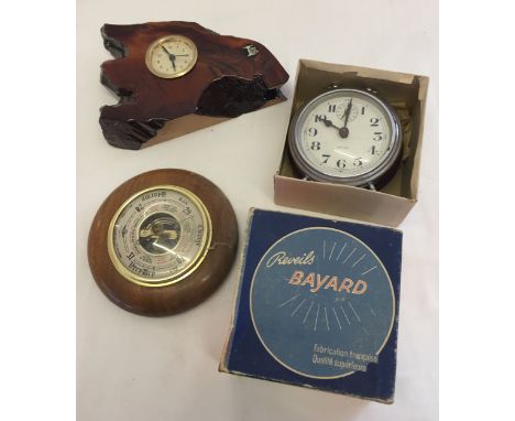 A boxed vintage Rovels Bayard clock together with a small wooden clock and a barometer.