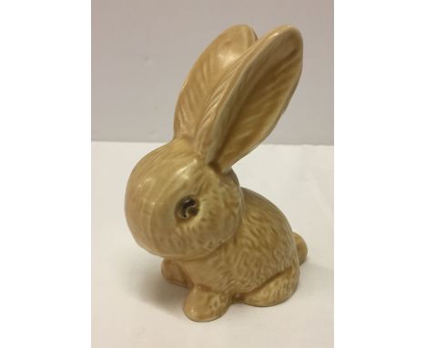 A Sylvac rabbit #990 in light brown 13cm tall (not impressed Sylvac).