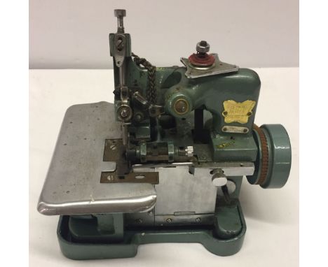 A vintage desktop motorised 'Butterfly' sewing machine, made in China.