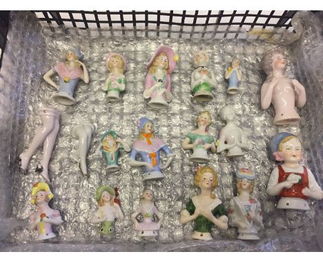 A collection of 18 ceramic half dolls to include 2 pairs of legs.