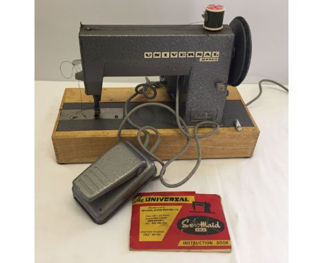 A vintage Universal Sewmaid sewing machine.