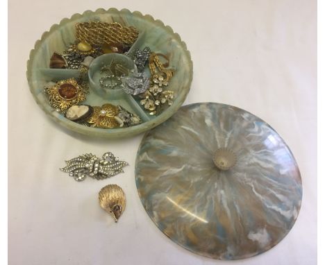 A vintage plastic jewellery box with a selection of costume jewellery items to include Sarah Coventry hedgehog brooch and dia