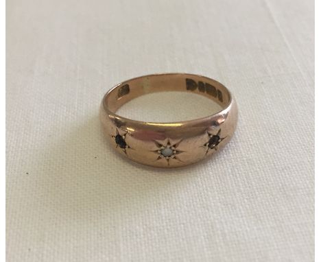 A vintage 9ct gold gypsy style ring with central diamond. 2 other stones missing. Total weight approx 3.1g.